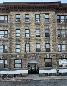 A stone-faced Allston apartment building